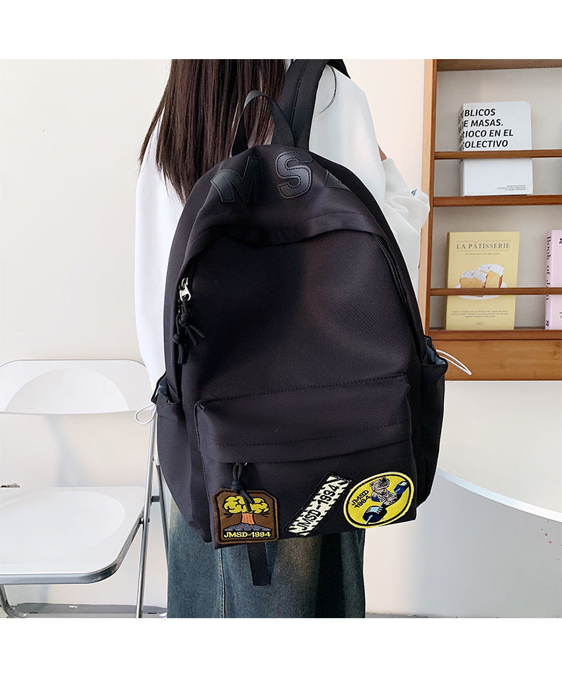 书包2026新款简约双肩包男孩小学生女孩大容量轻便耐磨通勤背包